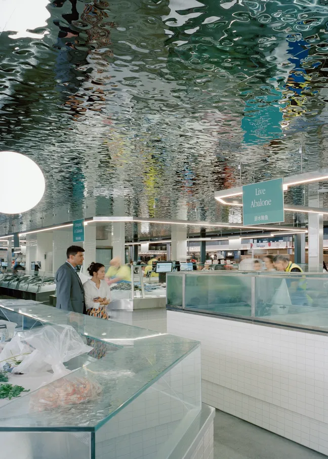 BVN Architecture Sydney civic architecture — New Sydney Fish Market interior with reflective water-inspired ceiling and