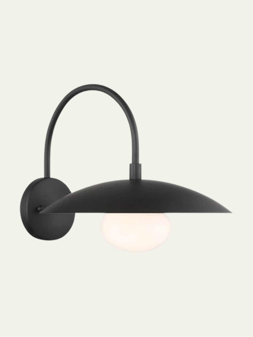 Shah Wall Sconce in matte black with an arched arm and a wide round shade over a glass globe light.