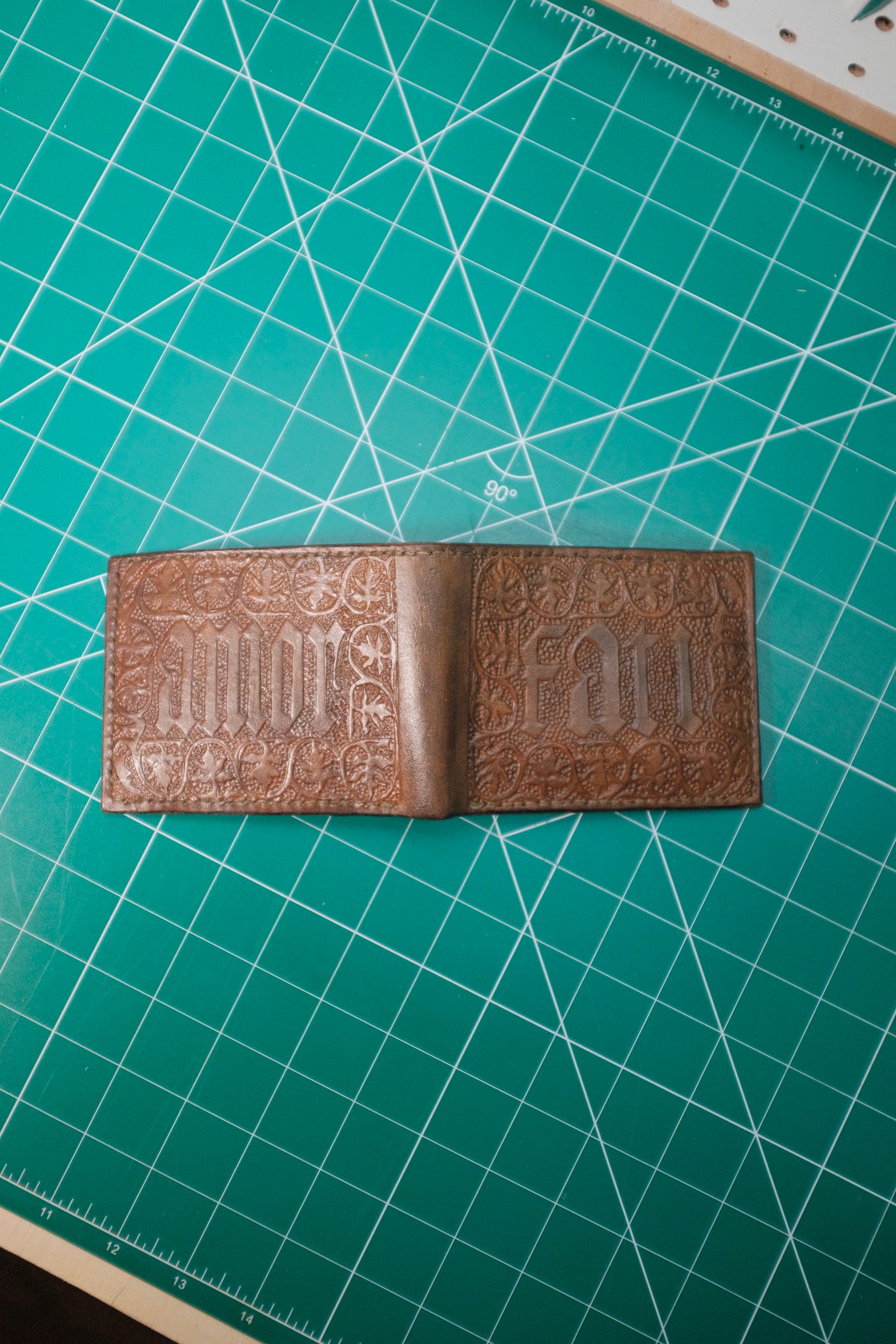 Wallet with tooling that reads "Amor Fati"