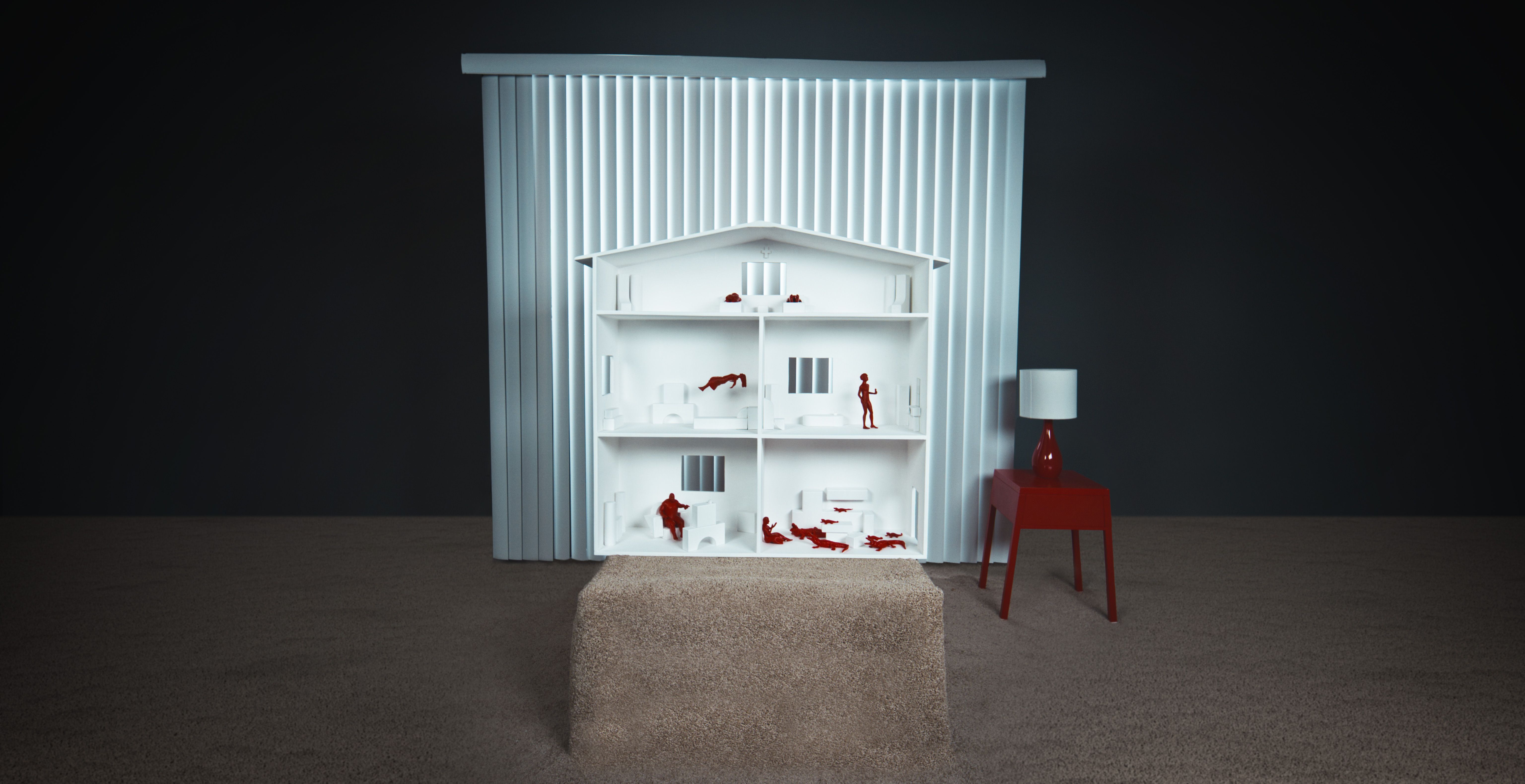 A dollhouse filled with red people