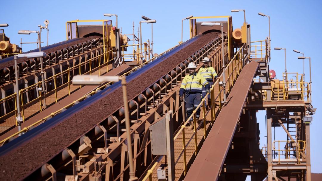 People walking down a machine