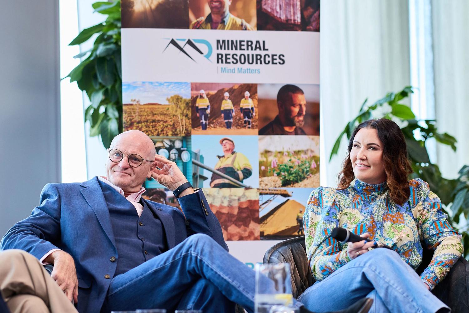 Chris Harris and Kelly Grey sitting on a panel
