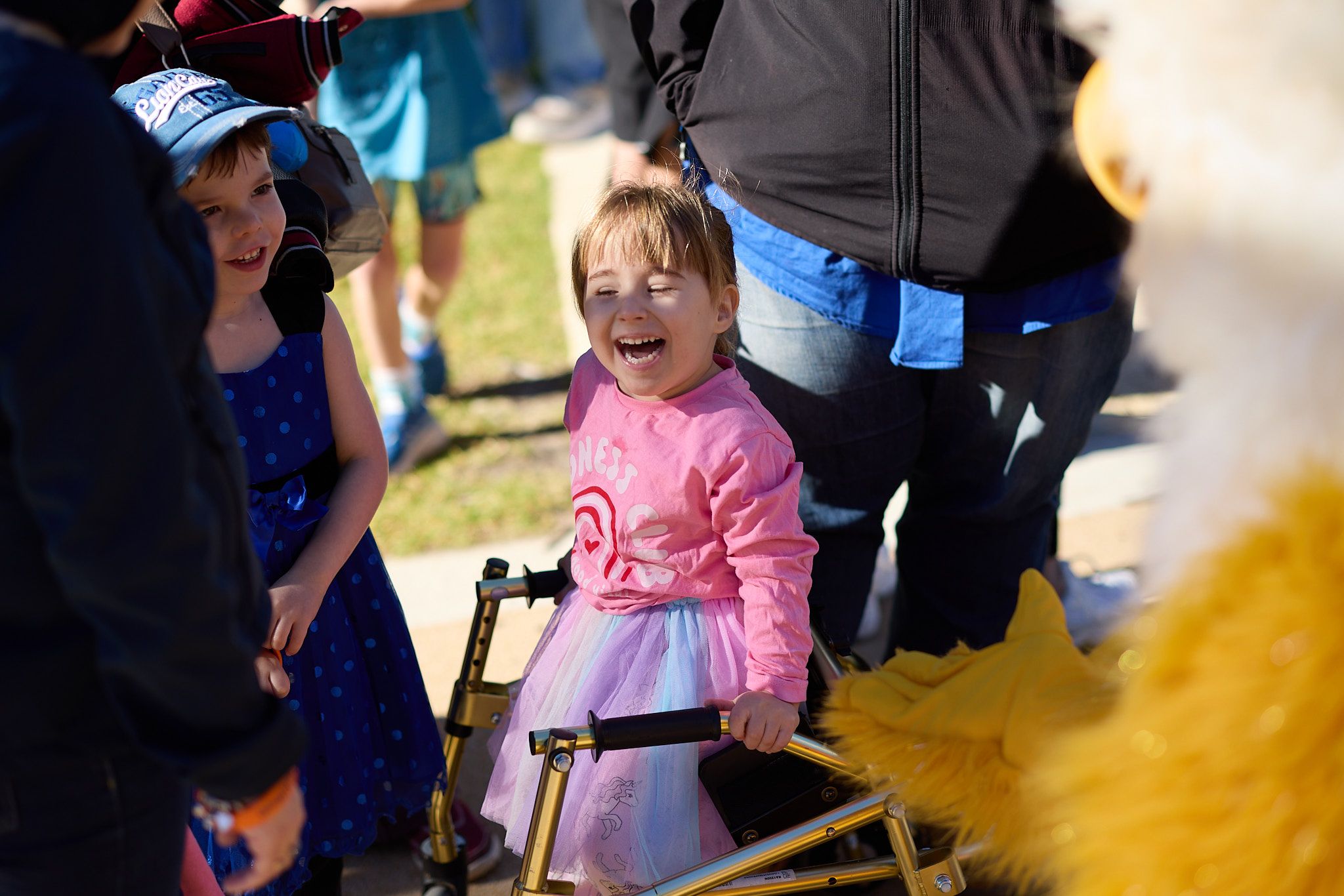 Little girl with a walker smiling