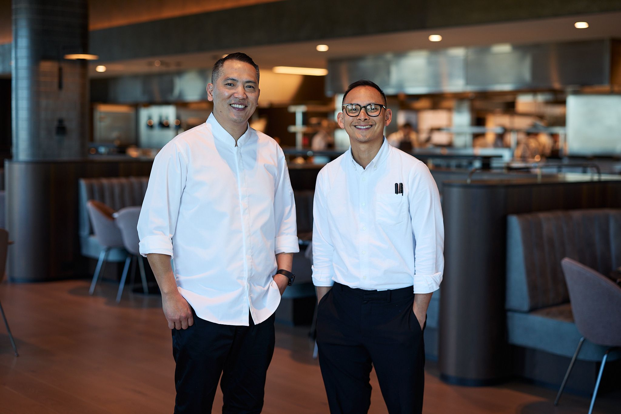 Two men standing side by side