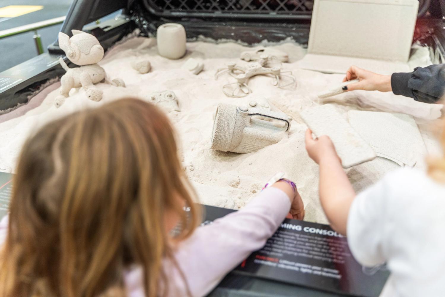 Child looking at sand