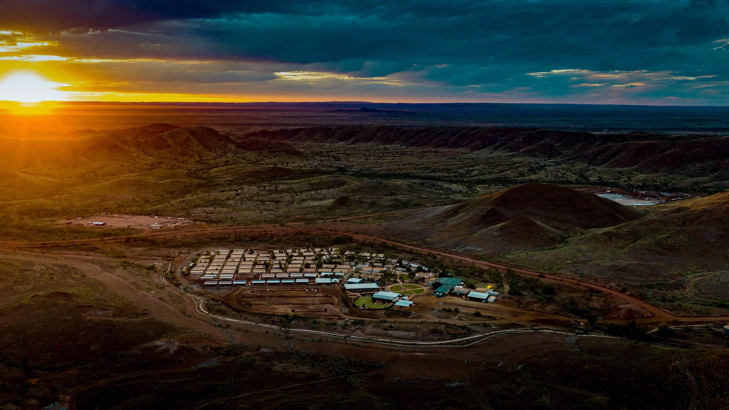 drone footage of a minesite at sunset
