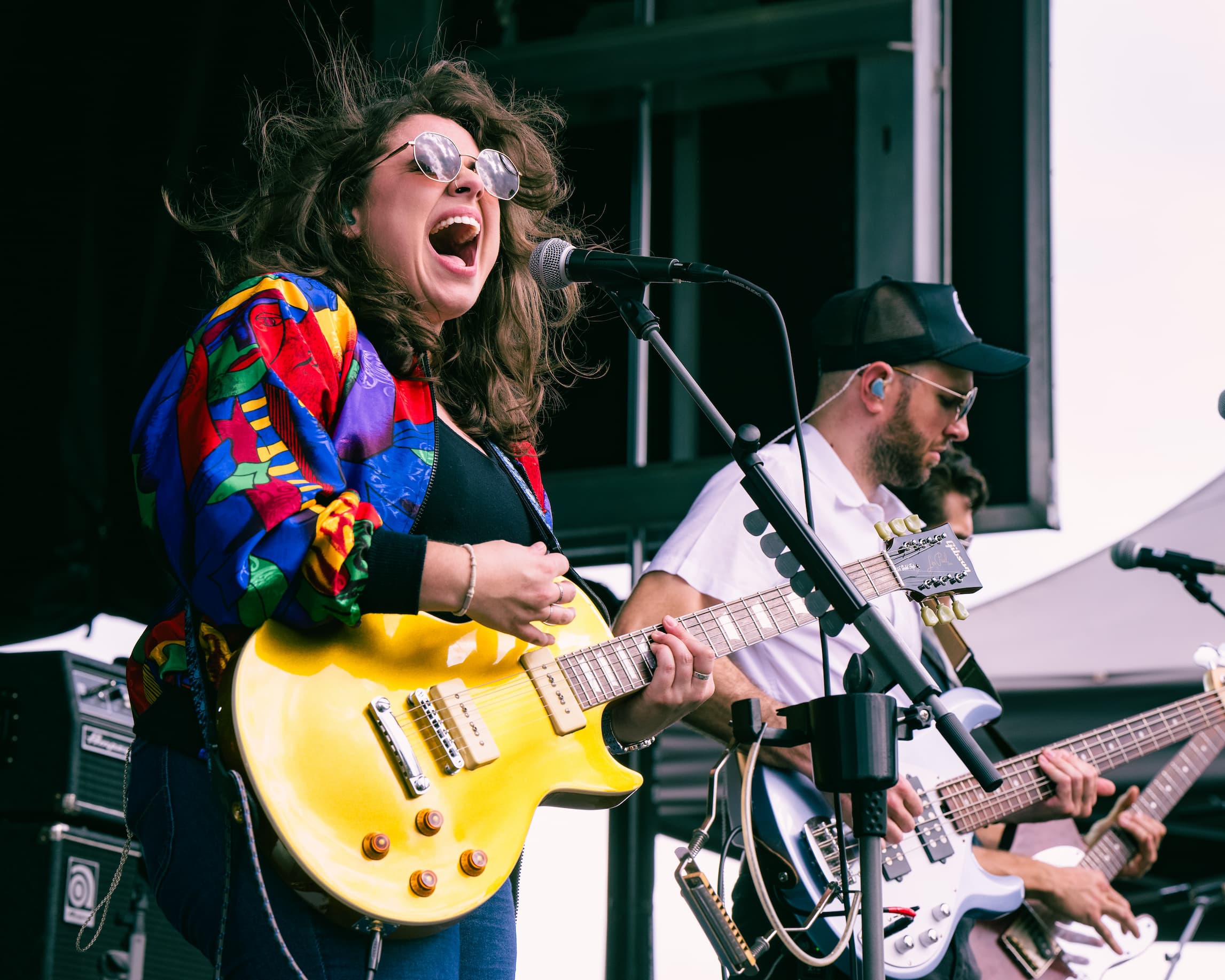 Molly Tuttle signing vinyl at the Holler Signing Tent at Orange Blossom Revue