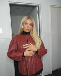 Megan Moroney wearing brown