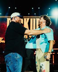 Bailey Zimmerman and Luke Combs performing together at Stagecoach 2025