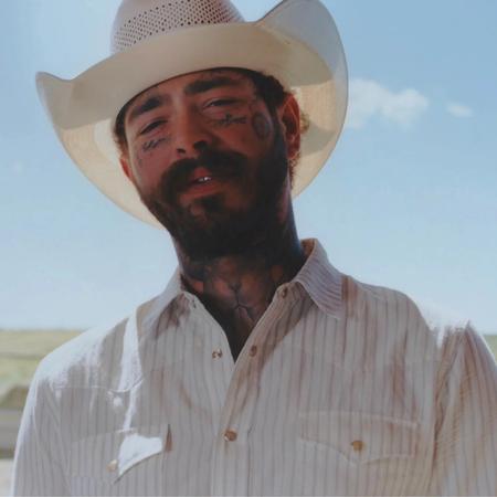 Post Malone wearing a cowboy hat