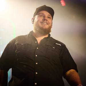 Luke Combs smiling on-stage