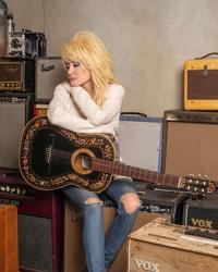 Dolly Parton surrounded by amps