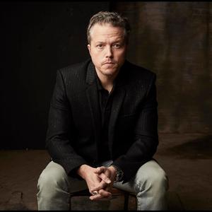 Jason Isbell in a black suit