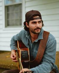 Brendan Walter wearing a backwards hat