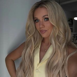Megan Moroney selfie wearing yellow