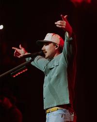 Morgan Wallen holding his hands in the air during his 2026 show at Nashville's The Pinnacle