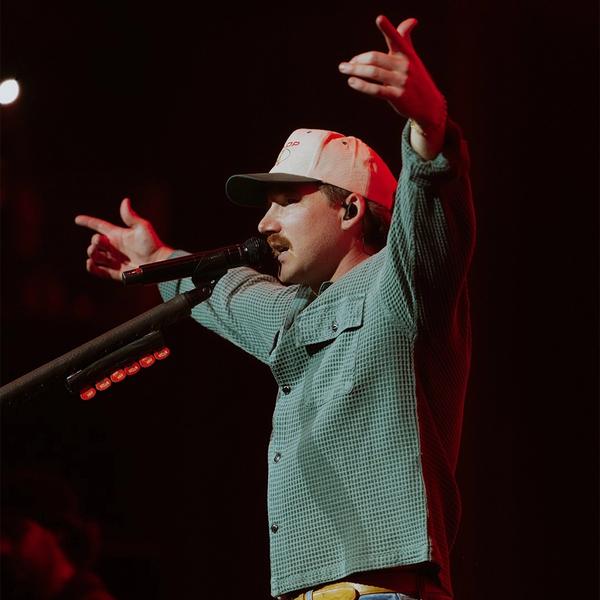 Morgan Wallen holding his hands in the air during his 2026 show at Nashville's The Pinnacle