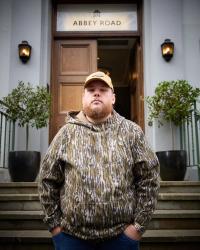 Luke Combs wearing camo outside Abbey Road