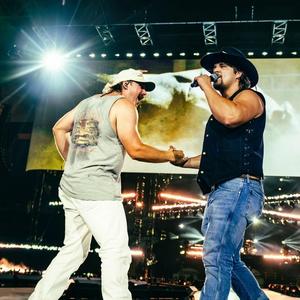Gavin Adcock performing with Morgan Wallen