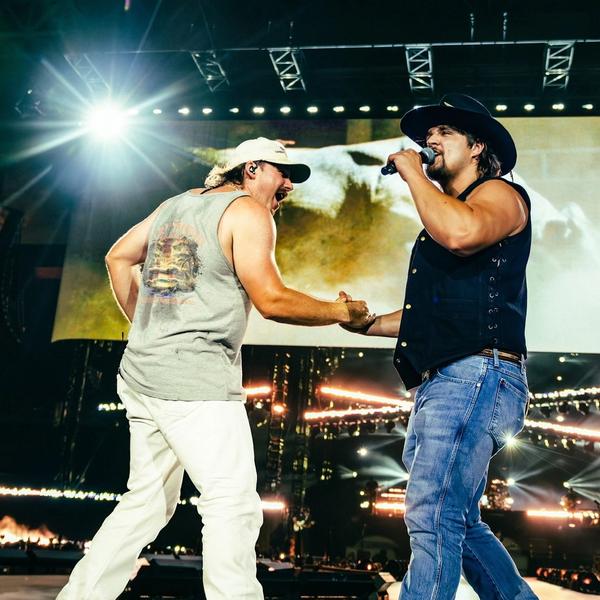 Gavin Adcock performing with Morgan Wallen