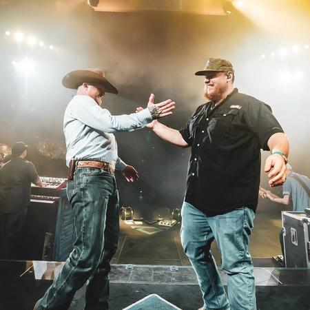 Luke Combs performing with Cody Johnson