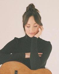 Kacey Musgraves against a white backdrop 