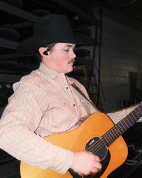 Zach Top playing his guitar