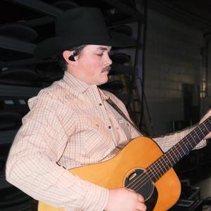 Zach Top playing his guitar