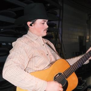 Zach Top playing his guitar