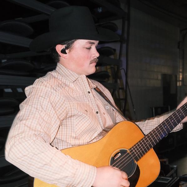 Zach Top playing his guitar