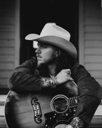 Brandon Lake wearing a cowboy hat in black and white