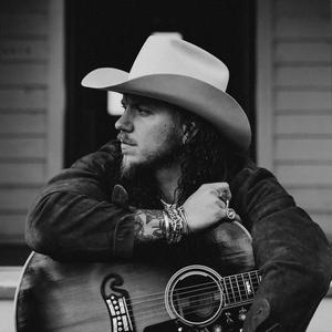 Brandon Lake wearing a cowboy hat in black and white