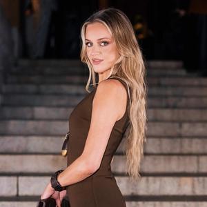 Kelsea Ballerini in a brown dress