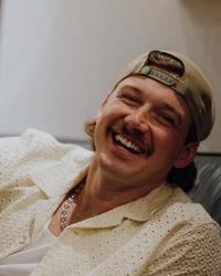 Morgan Wallen smiling in the studio