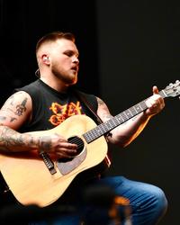 Zach Bryan performing in London in 2026