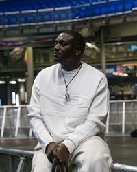 Akon backstage at an arena concert