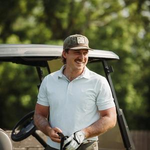 Morgan Wallen playing golf