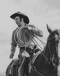 Luke Bell riding a horse with rope in black and white, taken by Mike Vanata.