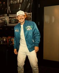 Morgan Wallen wearing a blue bomber jacket