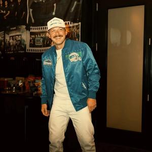 Morgan Wallen wearing a blue bomber jacket