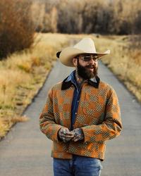 Post Malone wearing a cowboy hat