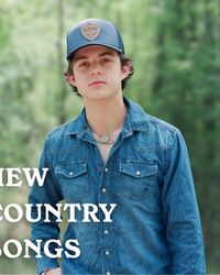 Waylon Wyatt in a forest in a denim shirt and blue cap.