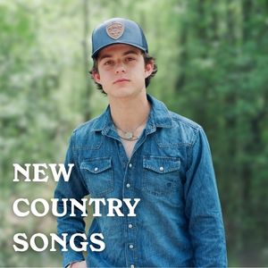 Waylon Wyatt in a forest in a denim shirt and blue cap.