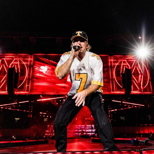 Morgan Wallen performing in a Tennessee Volunteers jersey at Neyland Stadium