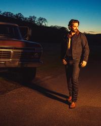 Thomas Rhett walking at sunset