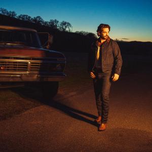 Thomas Rhett walking at sunset
