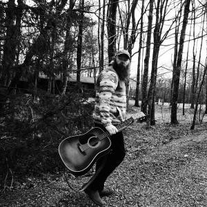 Nolan Taylor walking in the woods