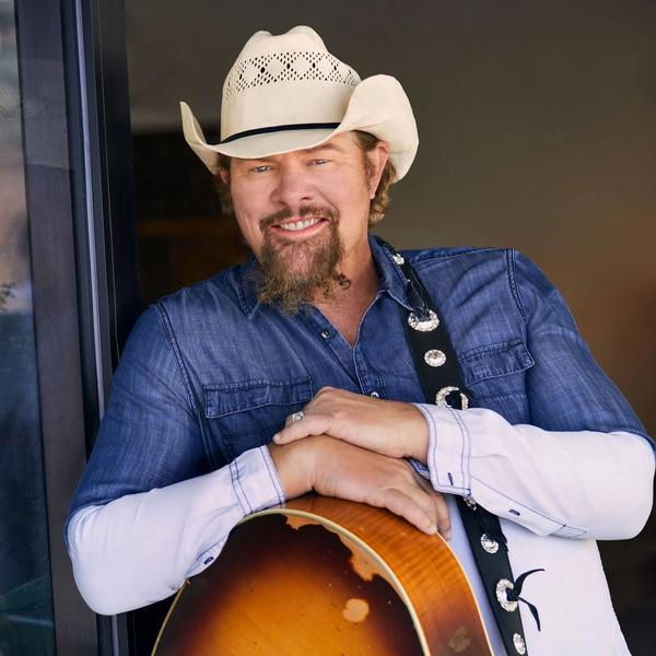Toby Keith smiling in press photo 2021
