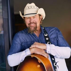Toby Keith smiling in press photo 2021