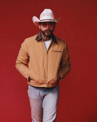Post Malone wearing a workwear jacket
